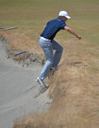 Jordan Spieth climbs out of a bunker on the seventh hole in the second round of the 115th U.S. Open Championship at Chambers Bay on June 19, 2015 in University Place, Washington.  SEA20150619043 KEVINxDIETSCH