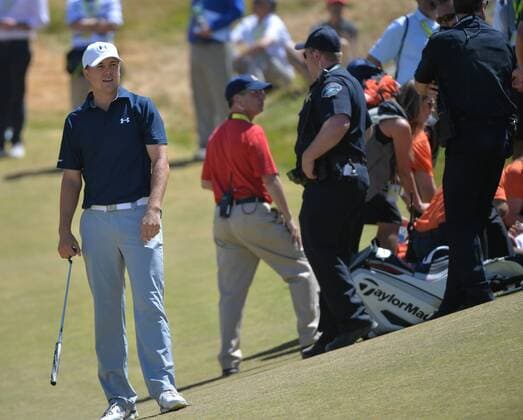 Jordan Spieth (L) calls off the media after Jason Day of Australia collapsed on the ninth hole in the second round of the 115th U.S. Open Championship at Chambers Bay on June 19, 2015 in University Place, Washington. Day recovered to putt out and finish his round.  SEA20150619045 KEVINxDIETSCH