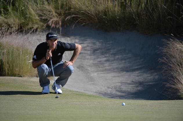 Dustin Johnson lines up a putt on the 10th green in the second round of the 115th U.S. Open Championship at Chambers Bay on June 19, 2015 in University Place, Washington.  SEA20150619069 KEVINxDIETSCH