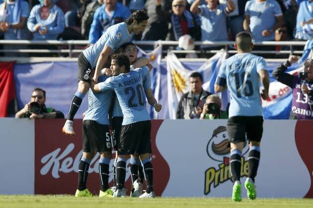 Football , Uruguay v Paraguay. Copa America Championship 2015 . Uruguay s player Jose Maria Jimenez, center, celebrates with teammates scoring against Paraguay during the group B football match of the 2015 Copa America at the La Portada stadium in Santiago.. 20 06 2015 Andres Pina Photosport Uruguay v Paraguay, Copa America 2015. 