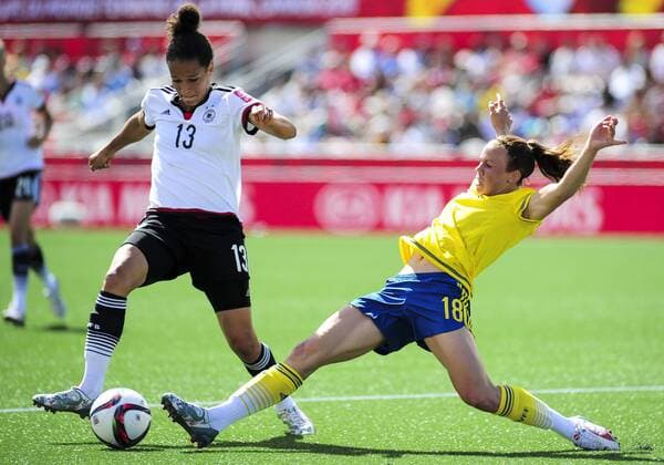 June 20, 2015: Celia Sasic ( 13) of Germany looks to evade a tackle from Jessica Samuelsson ( 18) of Sweden during the FIFA 2015 Women s World Cup Round of 16 match between Germany and Sweden at Lansdowne Stadium in Ottawa, Canada. SOCCER: JUN 20 FIFA Women s World Cup - Round of 16 - Germany v Sweden Icon2015062000002 EDITORIAL USE ONLY
