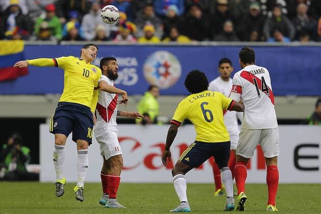 Football, Colombia v Peru. Copa America 2015. Colombia s player James Rodriguez, left, battles for the ball during the Copa America Group C, at German Becker stadium. Temuco. 21 06 2015 AlejandroZonez Photosport Colombia v Peru, Copa America 2015. 