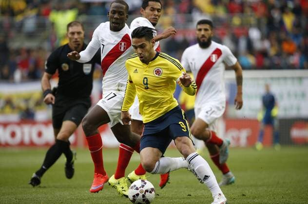 Football, Colombia v Peru. Copa America 2015. Colombia s player Ramadel Falcao, right, battles for the ball against Luis Advincula of Peru during the Copa America Group C, at German Becker stadium. Temuco. 21 06 2015 DragomirYankovic Photosport Colombia v Peru, Copa America 2015. 