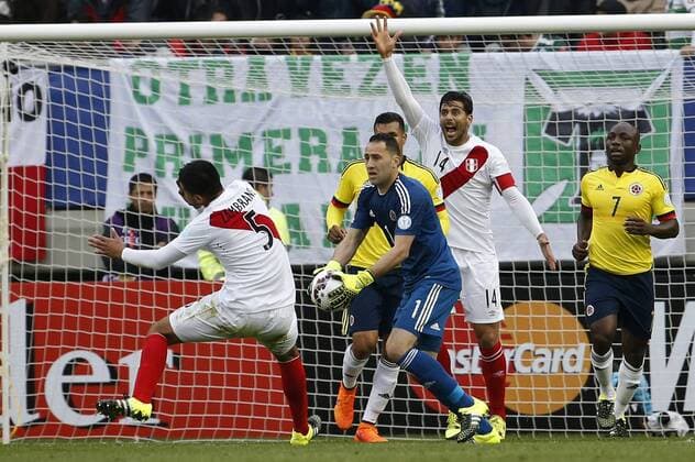 Football, Colombia v Peru. Copa America 2015. Colombia s goalkeeper David Ospina, center, battles for the ball against Carlos Zambrano of Peru during the Copa America Group C, at German Becker stadium. Temuco. 21 06 2015 DragomirYankovic Photosport Colombia v Peru, Copa America 2015. 