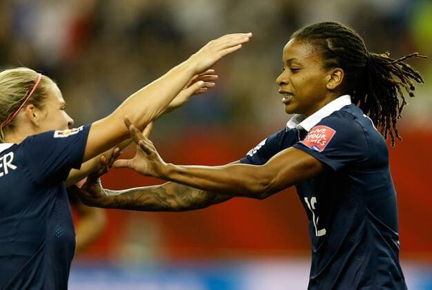 Elodie Thomis (R) of France celebrates scoring with Eugenie Le Sommer during the FIFA Women s World Canada 2015 round of 16 match between France and South Korea at Olympic Stadium in Montreal, Canada on June 21, 2015. France won the match 3-0. ) (SP)CANADA-MONTREAL-FIFA WOMEN S WORLD CUP-ROUND 16-FRANCE VS SOUTH KOREA WangxLili 