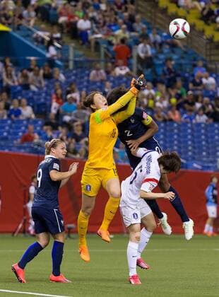 June 21, 2015 : France defender Wendie Renard 2 collides with Korea goalkeeper Kim Jungmi 18 during the 2015 FIFA Women s World Cup Round of 16 match between France and Korea at the Olympic Stadium in Montreal, Quebec, Canada. SOCCER: JUN 21 FIFA Women s World Cup - Round of 16 - France v Korea Icon15062115 EDITORIAL USE ONLY