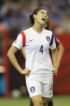 June 21, 2015: Seoyeon Shim (4) of the Korea Republic reacts to a foul during the second half at the FIFA Women s World Cup 2015 Group of 16 match between France and Korea at the Olympic Stadium in Montreal, Quebec, Canada. SOCCER: JUN 21 FIFA Women s World Cup - Round of 16 - France v Korea Icon150621009 EDITORIAL USE ONLY