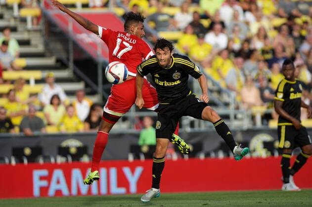 June 24, 2015 - Columbus, Ohio, U.S - Columbus Crew SC defender Michael Parkhurst (4) heads a ball toward the net in front of New England Revolution forward Juan Agudelo (17) in the first half of in the match between New England Revolution and Columbus Crew SC at Mapfre Stadium, Columbus, Ohio. MLS Fussball Herren USA 2015 - June 24 - New England at Columbus - ZUMAs304