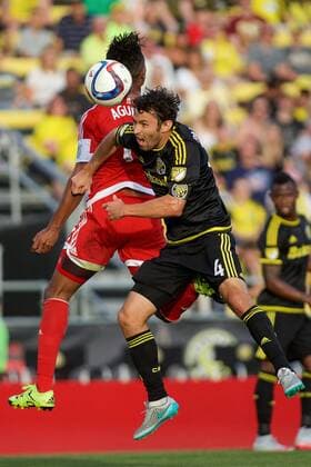 June 24, 2015 - Columbus, Ohio, U.S - Columbus Crew SC defender Michael Parkhurst (4) heads the ball behind New England Revolution forward Juan Agudelo (17) in the first half in the match between New England Revolution and Columbus Crew SC at Mapfre Stadium, Columbus, Ohio. MLS Fussball Herren USA 2015 - June 24 - New England at Columbus - ZUMAs304