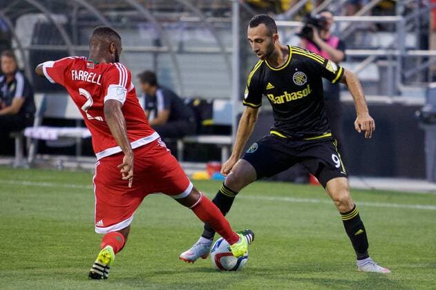 June 24, 2015 - Columbus, Ohio, U.S - New England Revolution defender Andrew Farrell (2) tries to kick the ball away from the control of Columbus Crew SC forward Justin Meram (9) in the second half in the match between New England Revolution and Columbus Crew SC at Mapfre Stadium, Columbus, Ohio. MLS Fussball Herren USA 2015 - June 24 - New England at Columbus - ZUMAs304