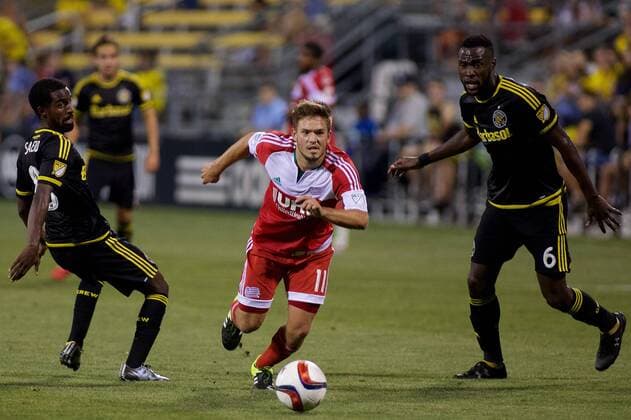 June 24, 2015 - Columbus, Ohio, U.S - New England Revolution midfielder Kelyn Rowe (11) splits Columbus Crew SC forward Mohammed Saeid (8) and Columbus Crew SC midfielder Tony Tchani (6) with the ball in the second half in the match between New England Revolution and Columbus Crew SC at Mapfre Stadium, Columbus, Ohio. MLS Fussball Herren USA 2015 - June 24 - New England at Columbus - ZUMAs304