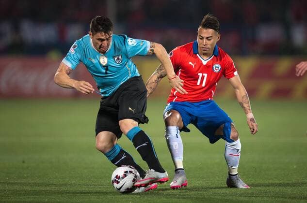 Copa America Championship 2015 . Chile s player Eduardo Vargas, right, battles for the ball against Cristian Rodriguez of Uruguay during the group A of the 2015 Copa America football match at the National stadium in Santiago, Chile. 24 06 2015 Fotoarena Photosport Chile v Uruguay, Copa America 2015. 