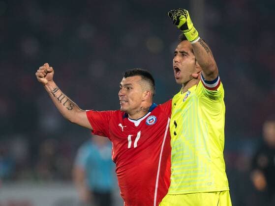 Chile s goalkeeper Claudio Bravo, right, and Gary Medel celebrate after the end game against uruguay for the group A of the 2015 Copa America football match at the National stadium in Santiago, Chile. 24 06 2015 Fotoarena Photosport Chile v Uruguay, Copa America 2015. 