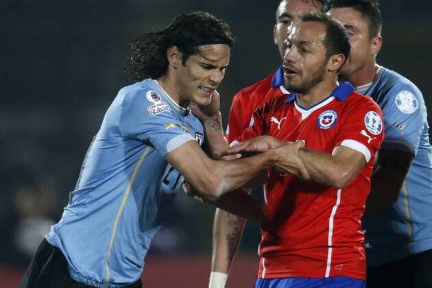 Chile v Uruguay. Copa America Championship 2015 . Uruguay s player Edinson Cavani, left, faces Marcelo Díaz of Chile during the group A of the 2015 Copa America football match at the National stadium in Santiago, Chile. 24 06 2015 Andres Pina Photosport Chile v Uruguay, Copa America 2015. 