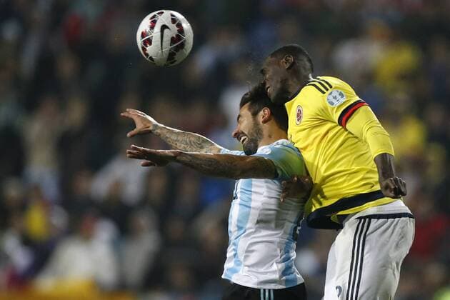 Football , Argentina v Colombia. Copa America Championship 2015 . Colombia s player Cristian Zapata, right, battles for the ball against Ezequiel Lavezzi of Argentina during the 2015 Copa America football championship quarterfinal match at the Sausalito stadium in Vina del Mar, Chile. 26 06 2015 AndresxPina Photosport Argentina v Colombia, Copa America 2015. 