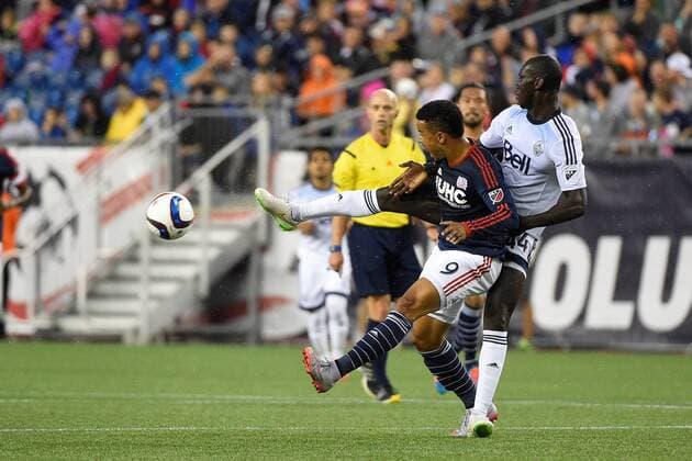 June 27, 2015 - Foxborough, Massachusetts, U.S. - Vancouver FC defender Pa Modou Kah (44) and New England Revolution forward Charlie Davies (9) battle for the ball during the MLS Fussball Herren USA game between Vancouver Whitecaps and the New England Revolution held at Gillette Stadium in Foxborough Massachusetts. Vancouver defeated New England 2-1. Eric Canha CSM MLS 2015: Whitecaps vs Revolution JUN 27 - ZUMAc04_