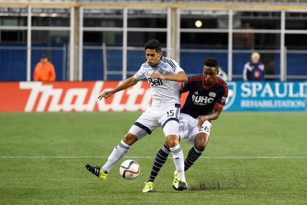 June 27, 2015 - Foxborough, Massachusetts, U.S. - Vancouver FC midfielder Matias Laba (15) and New England Revolution defender London Woodberry (28) in game action during the MLS Fussball Herren USA game between Vancouver Whitecaps and the New England Revolution held at Gillette Stadium in Foxborough Massachusetts. Vancouver defeated New England 2-1. Eric Canha CSM MLS 2015: Whitecaps vs Revolution JUN 27 - ZUMAc04_