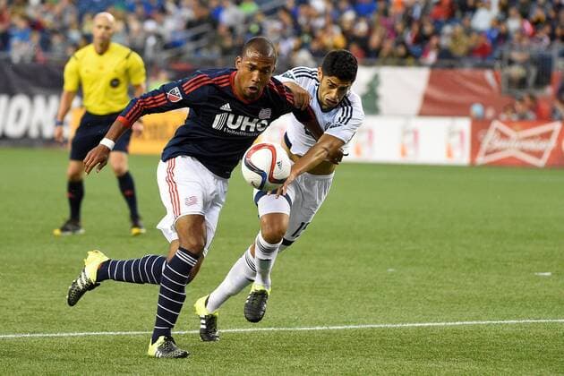 June 27, 2015 - Foxborough, Massachusetts, U.S. - New England Revolution forward Teal Bunbury (10) and Vancouver FC midfielder Matias Laba (15) battle for control during the MLS Fussball Herren USA game between Vancouver Whitecaps and the New England Revolution held at Gillette Stadium in Foxborough Massachusetts. Vancouver defeated New England 2-1. Eric Canha CSM MLS 2015: Whitecaps vs Revolution JUN 27 - ZUMAc04_