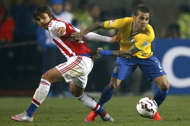 Football , Brazil v Paraguay. Copa America Championship 2015 . Brazil s player Dani Alves, right, battles for the ball against Oscar Romero of Paraguay during the 2015 Copa America football championship quarterfinal match at the Ester Roa stadium in Concepcion, Chile. 27 06 2015 Andres Pina Photosport Brasil v Paraguay, Copa America 2015. 