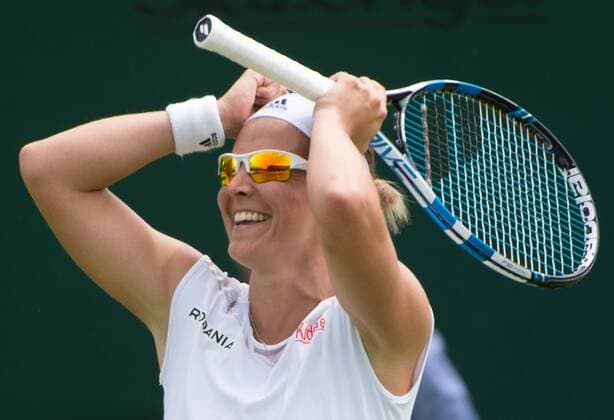 - LONDON, UNITED KINGDOM: Belgian Kirsten Flipkens jubilates after winning the first round match between Belgian Kirsten Flipkens and German Annika Beck at the 2015 Wimbledon grand slam tennis tournament at the All England Tennis Club, in southwest London, Britain, Monday 29 June 2015. BENOITxDOPPAGNE  x04653678x