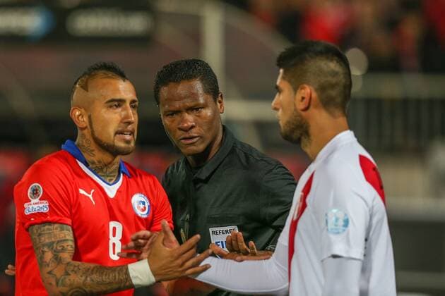 Chile x Peru SANTIAGO, CHILE - 06 29 2015: CHILE PERU X - Arturo Vidal of Chile and Carlos Zambrano of Peru during the match between Chile x Peru held at the National Stadium Julio Mart?nez Pr?danos the semifinals of the Copa America 2015 in Chile. (Photo: Carlos Ezequiel Vannoni FotoArena)  CarlosxEzequielxVannoni