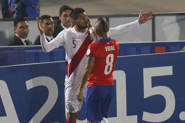 Chile s player Arturo Vidal, right , talks with Carlos Zambrano of Peru during the match of quarter finals of the 2015 Copa America at Nacional stadium. Santiago, Chile. 29 06 2015 MarceloxHernandez Photosport Chile v Peru, Copa America 2015. 