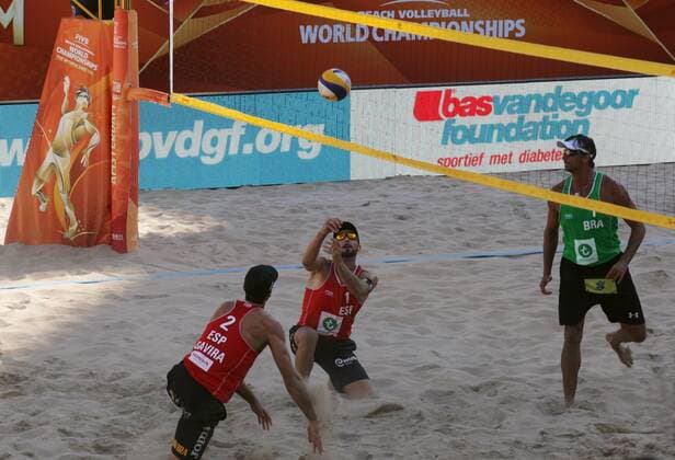 Gavira (L) and Herera (C) of Spain against Ricardo (R) of Brazil during the FIVB Beach volleyball Beachvolleyball World Championships male match between Brazil vs Spain at pool on June 30, 2015 in Amsterdam, Netherlands. Imago Paulo Amorim