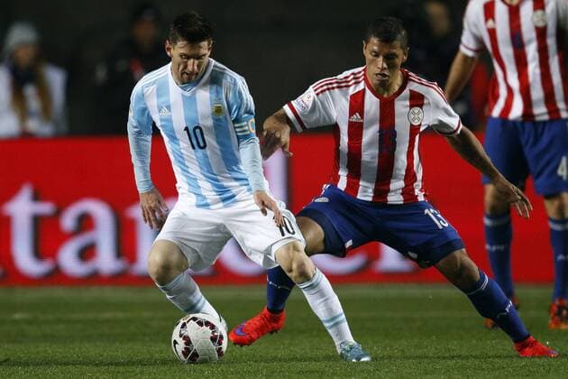 Argentina v Paraguay. Copa America Championship 2015 . Argentina s player Lionel Messi, left, battles for the ball against Richard Ortiz of Paraguay during the 2015 Copa America football championship semifinal match at the Ester Roa stadium in Concepcion . 30 06 2015 Andres Pina Photosport Argentina v Paraguay, semifinal Copa America 2015. 