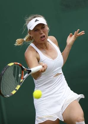 (150702) -- WIMBLEDON, July 2, 2015 -- Denmark s Caroline Wozniacki returns a shot during the lady s second round against Denisa Allertova of Czech Republic at 2015 Wimbledon Tennis Championships in London, Britain, July 2, 2015. Wozniacki won 2-0. ) (SP)BRITAIN-LONDON-TENNIS-WIMBLEDON CHAMPIONSHIPS YexPingfan 
