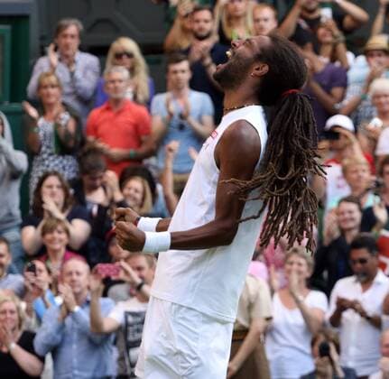 Germany s Dustin Brown celebrates after beating Spain s Rafael Nadal on day four of the 2015 Wimbledon championships, London on July 02, 2015. Brown won the match 7-5, 3-6, 6-4, 6-4.  LON20150702265 HUGOxPHILPOTT