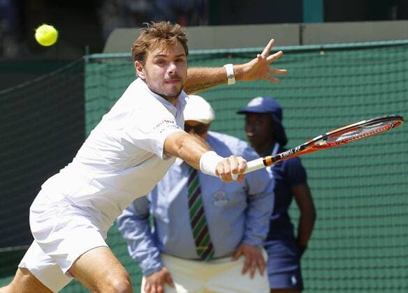 Wawrinka in Wimbledon 3rd-round match Stan Wawrinka of Swizerland reaches for the ball during his Wimbledon third-round match against Spain s Fernando Verdasco on July 3, 2015. 