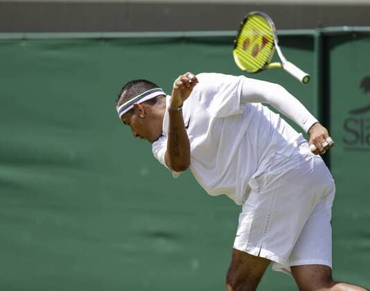 03.07.2015. Wimbledon, England. The Wimbledon Tennis Championships. Gentlemens Singles third round match between twenty sixth seed Nick Kyrgios (AUS) and seventh seed Milos Raonic (CAN). Nick Kyrgios smashes his racket to the ground in anger so hard that it bounces into the upper tier of the grandstand xCraigxMercerx  ActionPlus11637225