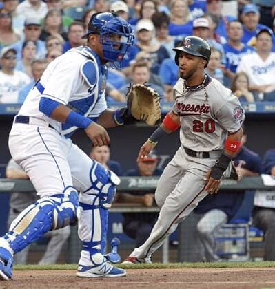 July 3, 2015 - Kansas City, MO, USA - The Minnesota Twins Eddie Rosario (20) scores behind Kansas City Royals catcher Salvador Perez on a single by Miguel Sano in the second inning on Friday, July 3, 2015, at Kauffman Stadium in Kansas City, Mo. Minnesota at Kansas City - ZUMAm67_