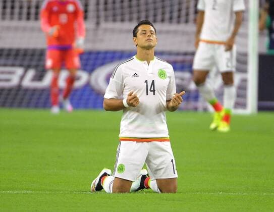July 1st, 2015 - Mexico FW Javier Hernandez (14) doing his ritual during the 2015 Mexican national team Nationalteam United States Tour, Mexico vs Honduras at NRG Stadium in Houston, Texas. SOCCER: JUL 01 Mexico v Honduras Icon15070107 EDITORIAL USE ONLY