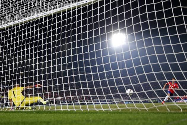 Football, Chile v Argentina. Copa America 2015 . Chile s player Alexis Sanchez, right, scores the definitive penalty against Argentina during the finals of the Copa America 2015 football match held at the Nacional stadium in Santiago, Chile. 04 07 2015 Andres Pina Photosport Chile v Argentina, Copa America 2015. 