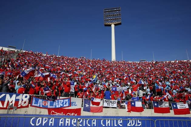 Football, Chile v Argentina. Copa America 2015 . Chile s fans hold flags prior to the finals of the Copa America 2015 football match played against Argentina at the Nacional stadium in Santiago, Chile. 04 07 2015 Martin Thomas Photosport Chile v Argentina, Copa America 2015. 