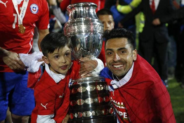 Football, Chile v Argentina. Copa America 2015 . Chile s player Gonzalo Jara, lifts the cup after winning the Copa America 2015 in a football match against Argentina at the Nacional stadium in Santiago, Chile. 04 07 2015 Andres Pina Photosport Chile v Argentina, Copa America 2015. 