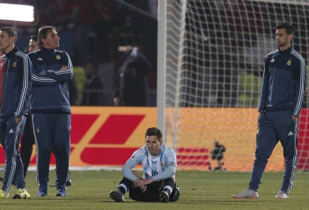 (150705) -- SANTIAGO, July 4, 2015 -- Lionel Messi (C) of Argentina reacts after the final match of the Copa America Chile 2015 against Chile, at the National Stadium, in Santiago, capital of Chile, on July 4, 2015. Chile won the final match of the Copa America 2015 against Argentina after the penalty kick 4-1. ) (ce) (SP)CHILE-SANTIAGO-COPA AMERICA-FINAL-CHILE VS ARGENTINA GuillermoxArias 