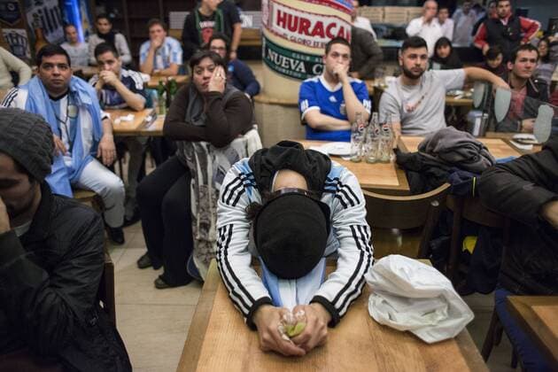 (150705) -- BUENOS AIRES, July 4, 2015 -- Fans of Argentina react after the final match of Copa America Chile 2015 between Chile and Argentina, at the Obelisk of Buenos Aires, Argentina, on July 4, 2015. Chile won the final match of the Copa America 2015 against Argentina after the penalty kick. Martin Zabala) (jp) (SP)ARGENTINA-BUENOS AIRES-COPA AMERICA-CHILE VS ARGENTINA-FANS e MARTINxZABALA 