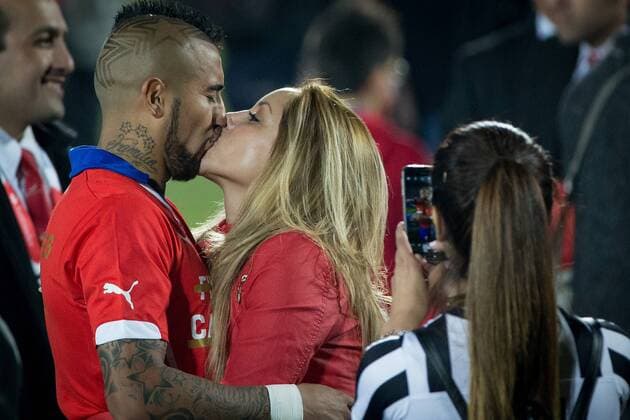 (150705) -- SANTIAGO, July 4, 2015 -- Arturo Vidal (L) of Chile kisses his wife after the final match of the Copa America Chile 2015 against Argentina, at the National Stadium, in Santiago, capital of Chile, on July 4, 2015. Chile won the final match of the Copa America 2015 against Argentina after the penalty kick 4-1. ) (ce) (SP)CHILE-SANTIAGO-COPA AMERICA-FINAL-CHILE VS ARGENTINA PedroxMera 