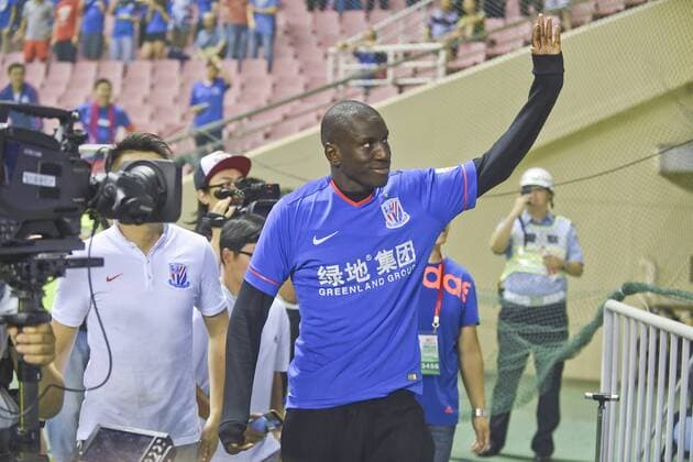 SHANGHAI, CHINA - JULY 04: (CHINA OUT) Demba Ba makes his debut prior to the CSL Chinese Football Association Super League match between Shanghai Shenhua and Guangzhou R&F at Hongkou Football Stadium on July 4, 2015 in Shanghai, China.  CFP469903344 