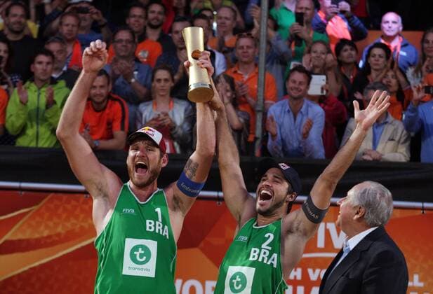 Alison Cerutti (L) from Brazil celebrates with his teammate Bruno Oscar Schmidt (R) during the FIVB Beach volleyball Beachvolleyball World Championships Male Final Match between Brazil vs Netherlands on July 5, 2015 in The Hague, Netherlands. Imago Paulo Amorim