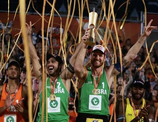 Alison Cerutti (2ndl ) from Brazil celebrates with his teammate Bruno Oscar Schmidt (2ndR ) during the FIVB Beach volleyball Beachvolleyball World Championships Male Final Match between Brazil vs Netherlands on July 5, 2015 in The Hague, Netherlands. Imago Paulo Amorim
