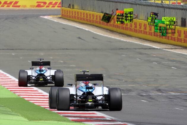 05.07.2015. Silverstone, England. Formula 1 British Grand Prix. Felipe Massa, Williams Martini Racing, leads from Valtteri Bottas, Williams Martini Racing, in the early stages. xTimxWilliamsx  ActionPlus11638244