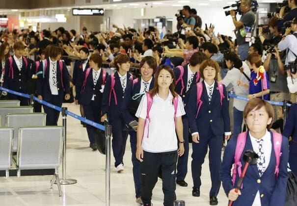 Nadeshiko Japan arrive home from Women s World Cup Nadeshiko Japan players arrive at Narita International Airport, northeast of Tokyo, on July 7, 2015, following their 5-2 loss to the United States in the final of the Women s World Cup in Canada. They were greeted by around 500 fans and over 200 members of the media at the airport. 