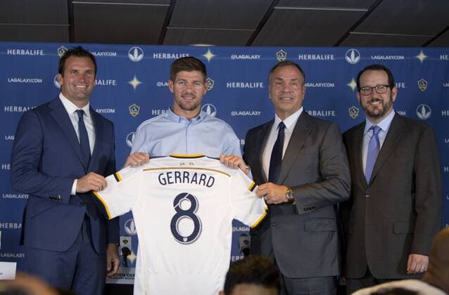 July 7, 2015 - Carson, California, U.S - New Los Angeles Galaxy midfielder Steven Gerrard 8 (2nd L) poses with Chris Klein, (L) LA Galaxy President, Bruce Arena(2nd R), LA Galaxy Head Coach and General Manager and Dan Beckerman, AEG President and CEO, after a news conference on Tuesday July 7, 2015 at StubHub Center in Carson, California. The former Liverpool captain Steven Gerrard is scheduled to play his first MLS Fussball Herren USA match on Friday, July 17 at StubHub Center against San Jose Earthquakes. Steven Gerrard is introduced to the media - ZUMAp124