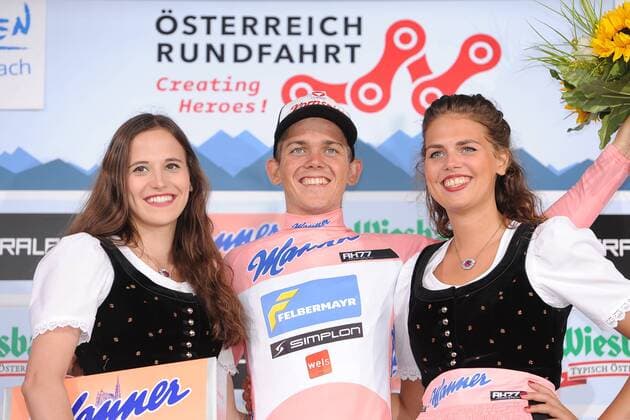 Gregor MUEHLBERGER ( AUT Team Felbermayr Simplon Wels ) uebernimmt das Trikot des besten Oesterreichischen Fahrers bei der Oesterreich Rundfahrt - Siegerehrung - Zeremonie - Jubel - Freude - Emotionen - Hostessen - Mimik - Gestik - Querformat - quer - horizontal - Event Veranstaltung: Oesterreich Rundfahrt 2015 - Stage 4 4.Etappe: Gratwein (Stift Rein) nach Villacher Alpen (Dobratsch) 210.2 km - Location Ort: Dobratsch - Austria - Oesterreich - Europe - Europa - Date Datum: 08.07.2015