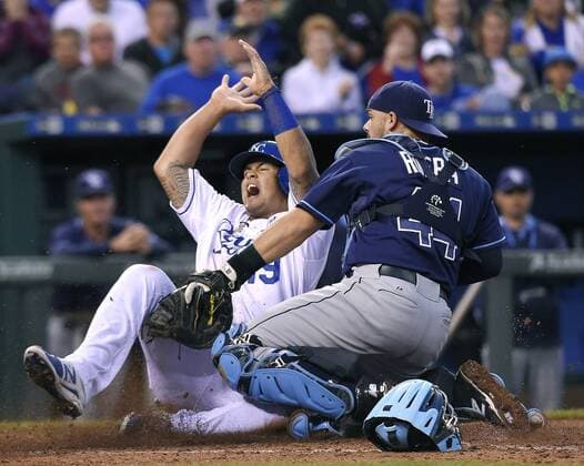 July 8, 2015 - Kansas City, MO, USA - The Kansas City Royals Cheslor Cuthbert scores ahead of the tag from Tampa Bay Rays catcher Rene Rivera (44) on a single by Lorenzo Cain in the fifth inning on Wednesday, July 8, 2015, at Kauffman Stadium in Kansas City, Mo. Tampa Bay at Kansas City - ZUMAm67_