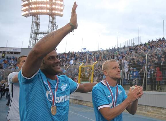 ST. PETERSBURG, RUSSIA. JULY 12, 2015. Zenit s Hulk (L) and Igor Smolnikov celebrate victory in a football match for the 2015 Russian Super Cup against FC Lokomotiv Moscow at the Petrovsky Stadium. FC Zenit St. Petersburg won the game 4:2 in a penalty shoot-out. Ruslan Shamukov TASS  TS007933