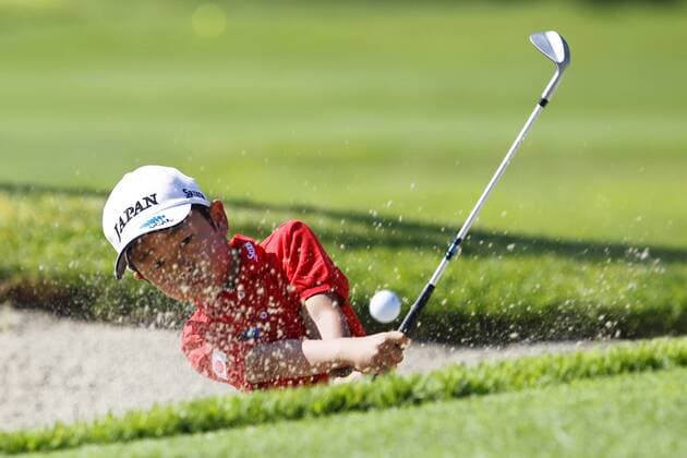 July 14, 2015 - San Diego, California, United States - July 14, 2015_San Diego, CA_USA_ Keita Yobiko hits out of the sand during the Junior World Golf Championships 6 and under division at Colina Park Golf Course. Photo by Keita Yobiko hits out of the sand during the Junior World Golf Championships 6 and under division at Colina Park Golf Course. - ZUMAs44_